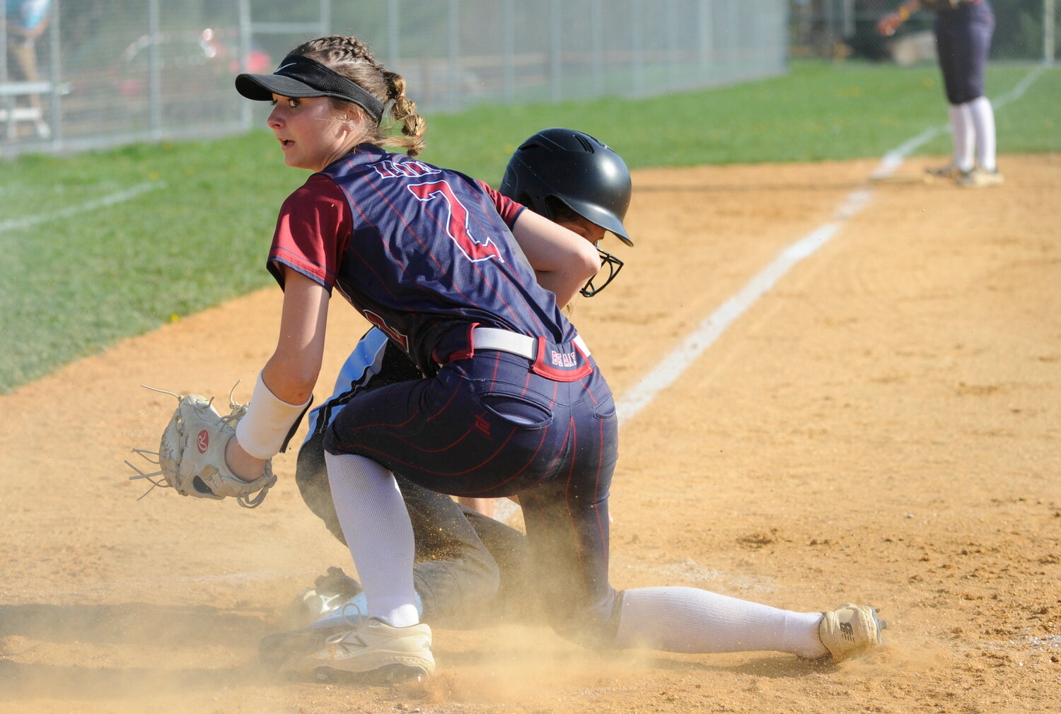 Tri-Valley’s winning hurler Jenna Carmody tags out Lady Bulldogs runner Gracyn Halloran in a close play at home as she backs up her catcher. Carmody tossed 7 innings, giving up 5 hits, and went 2-for-3, scored 2 runs, 3 RBIs and 2 steals.